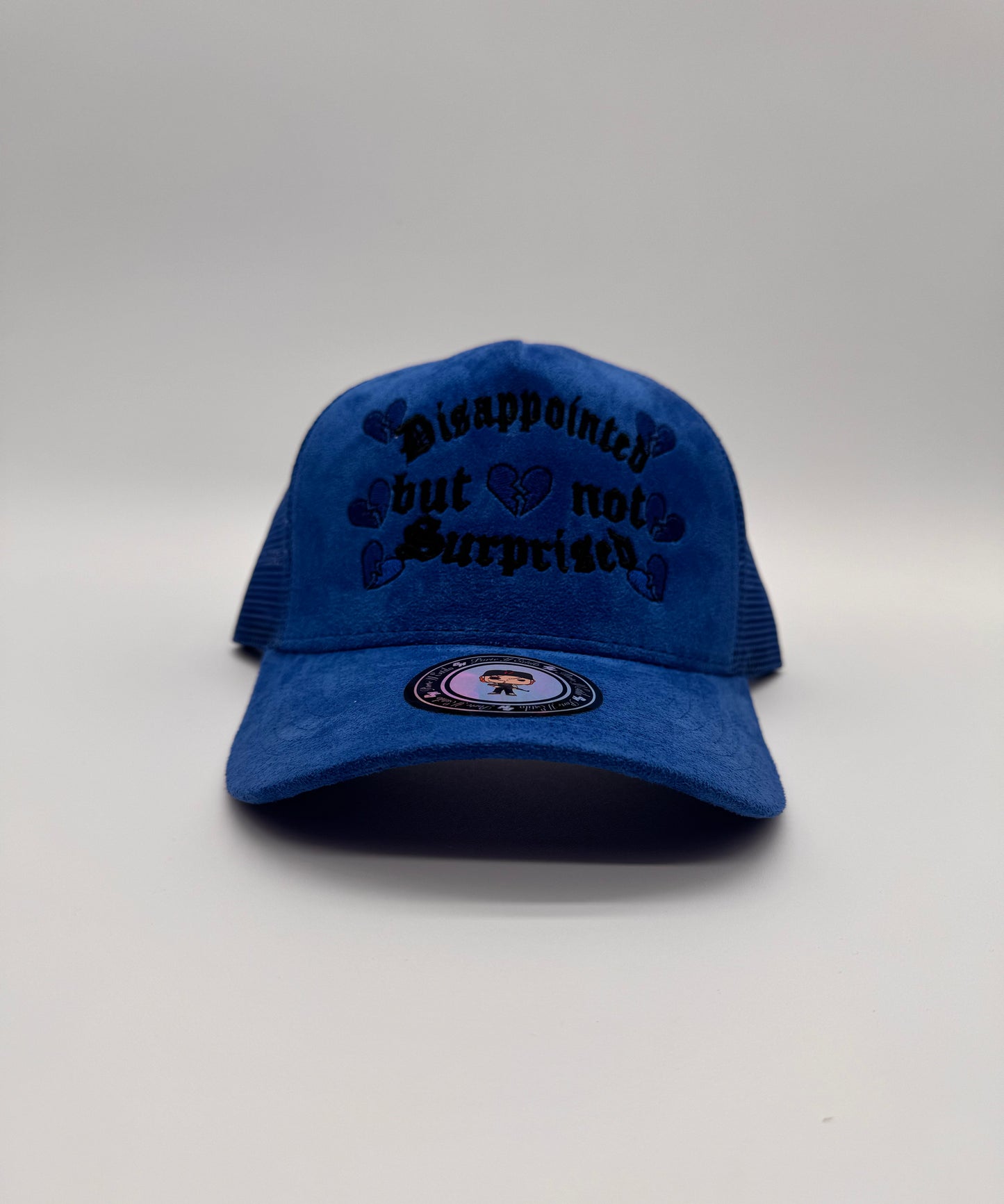 Disappointed but not surprised blue trucker hat