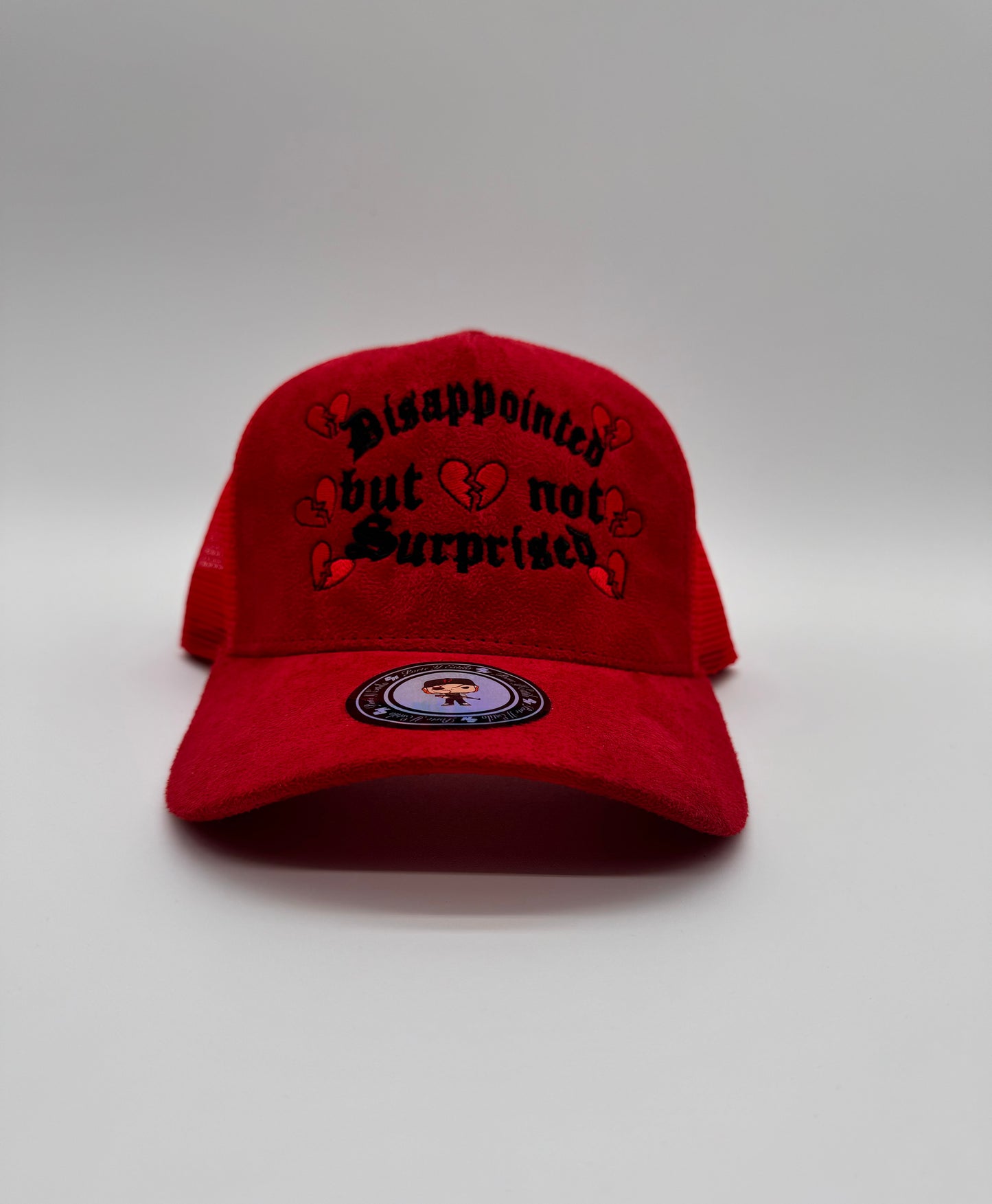 Disappointed but not surprised red trucker hat